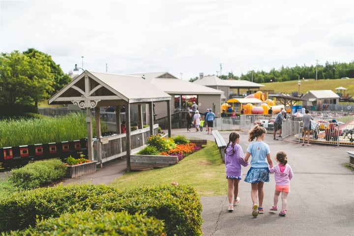 Local business owner shaking hands with a recreation director at a community event