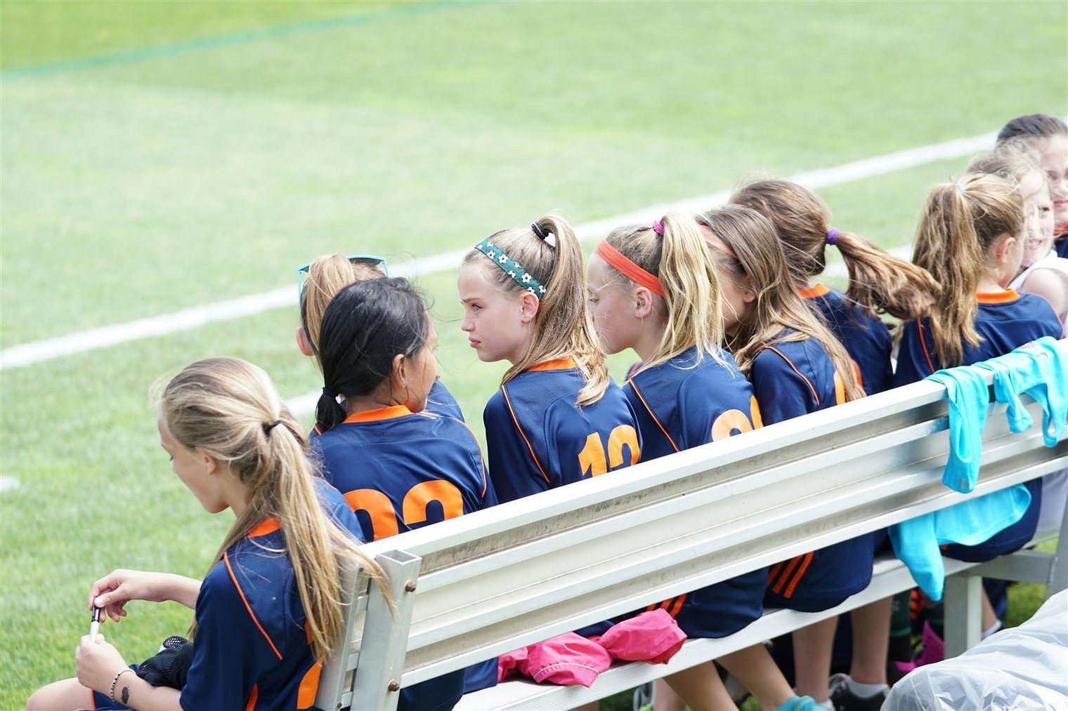 Parent writing a check at a youth sports registration table