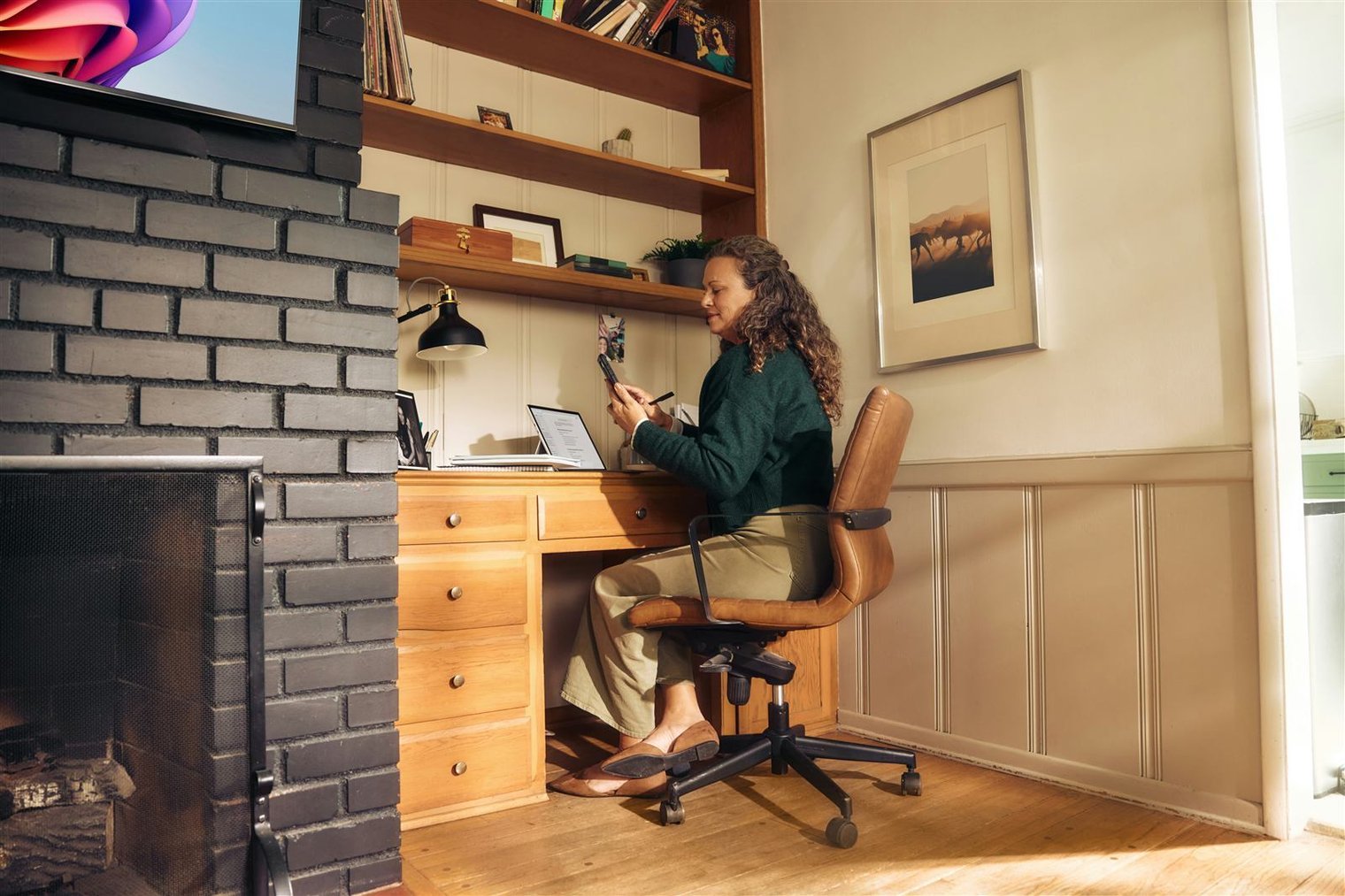 Instructor on a laptop screen teaching an online fitness class, student watching from home