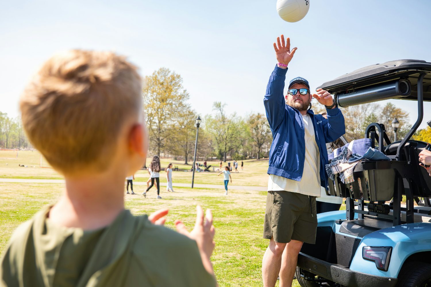 Recreation staff member playing with kids at a community event
