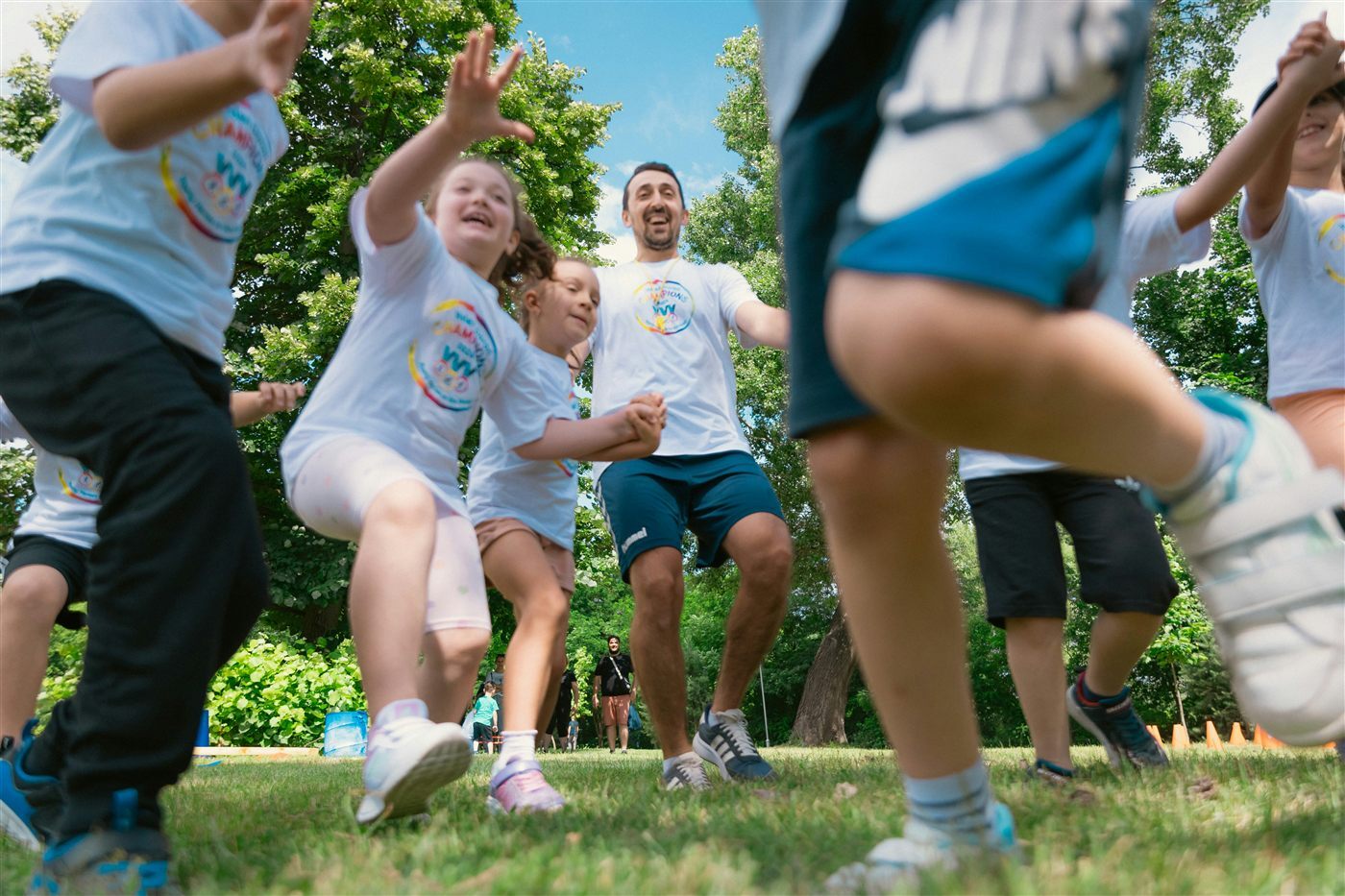 Recreation leader directing children in an outdoor program